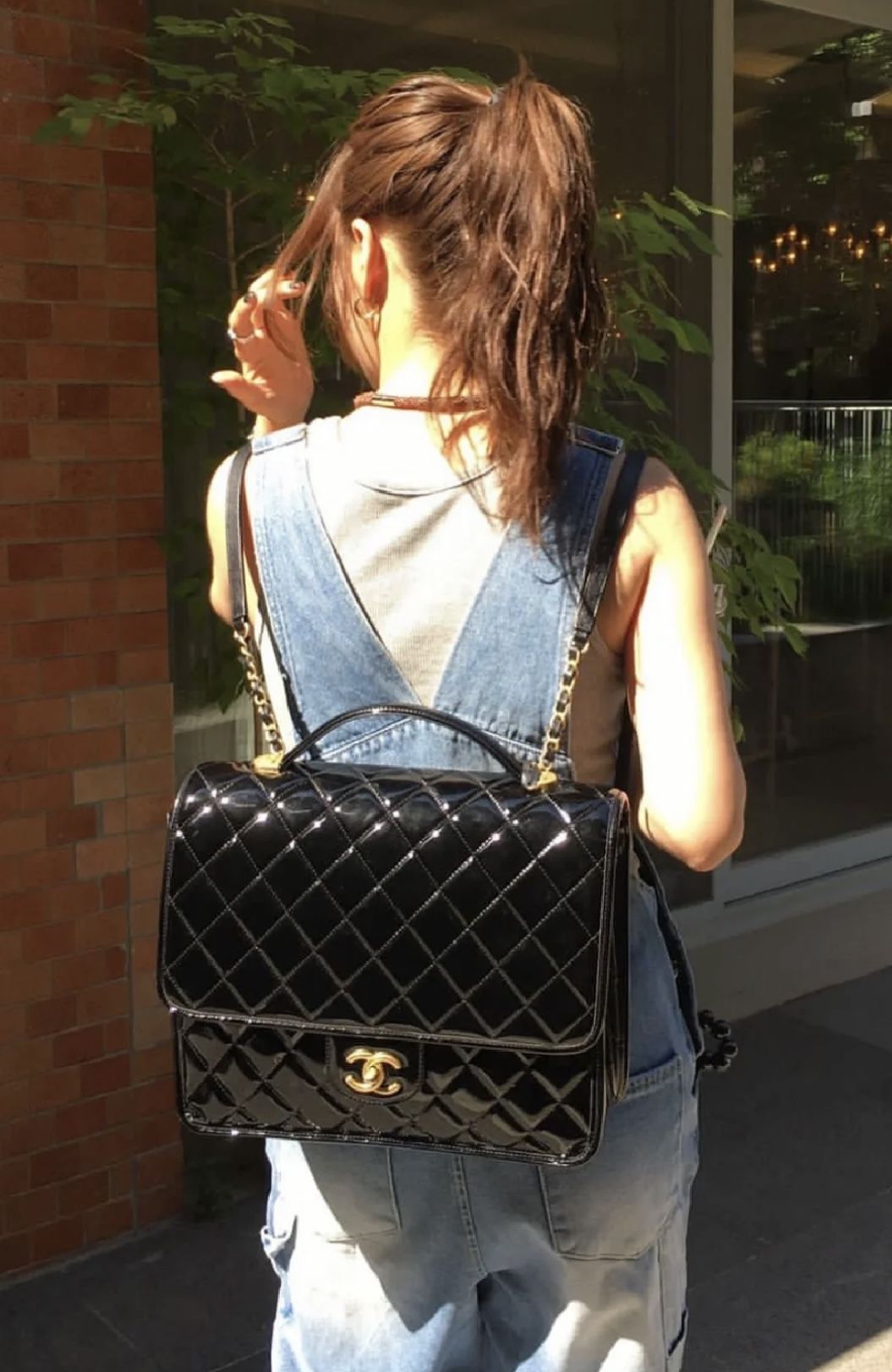 CHANEL 22K patent leather backpack